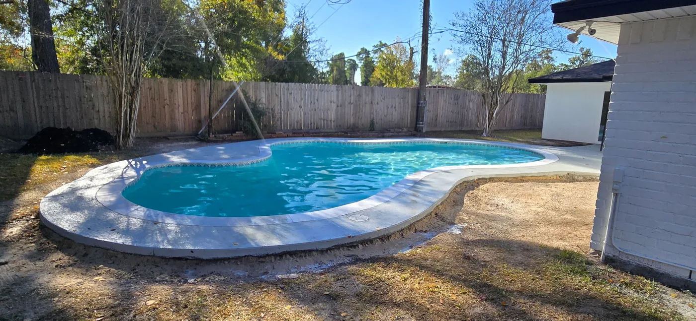 Remodeled backyard pool with new plaster, tile, coping and decking